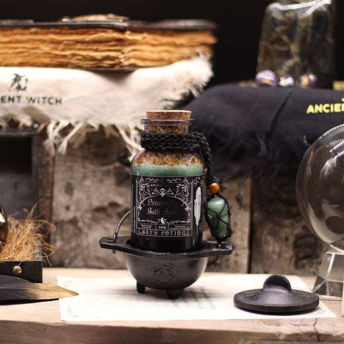 Ancient Witch Prosperity Bath Spell Potion displayed with witchcraft accessories