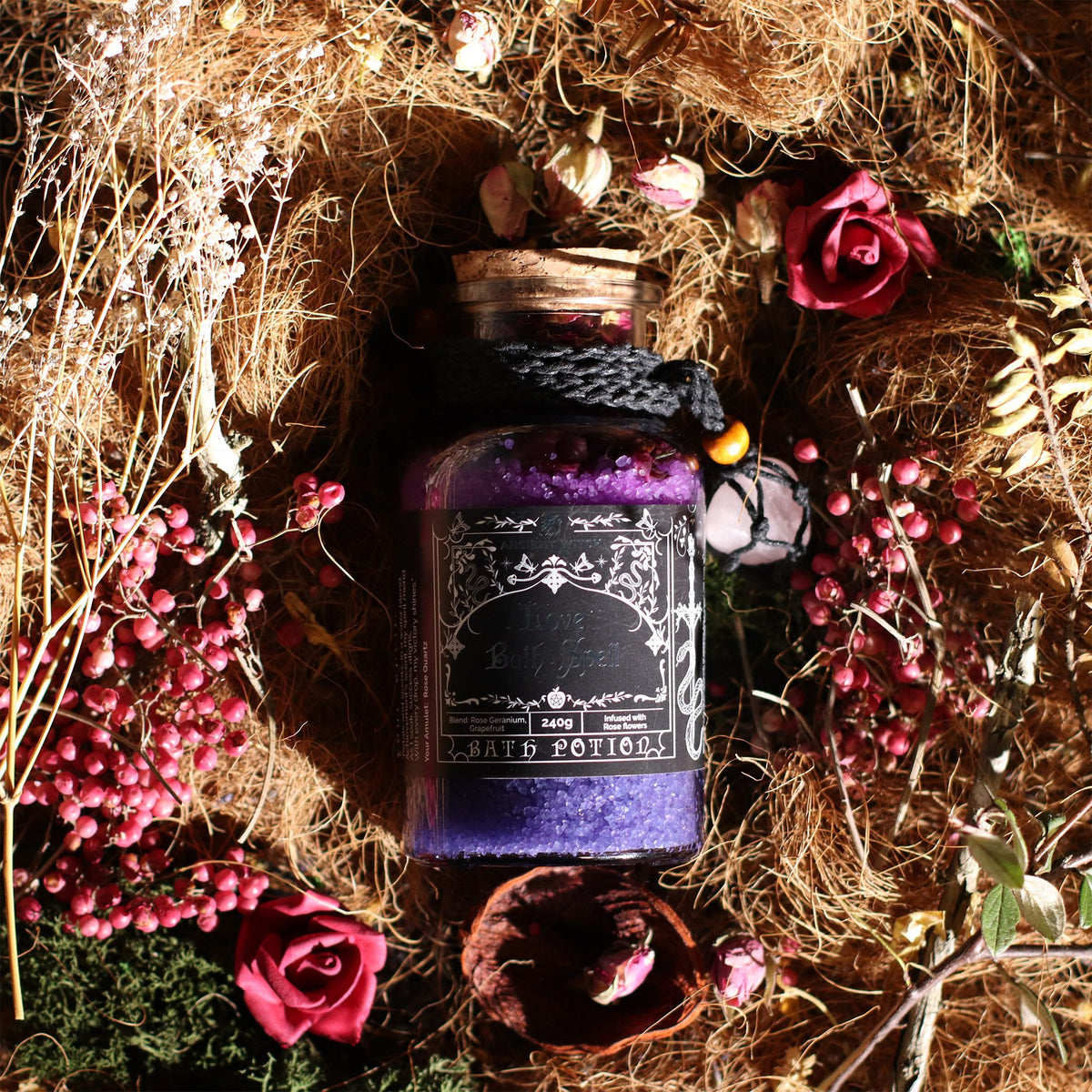 1. Ancient Witch Love Bath Spell Potion displayed with dried roses