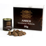 Amber incense resin with packaging and a canister on a white background