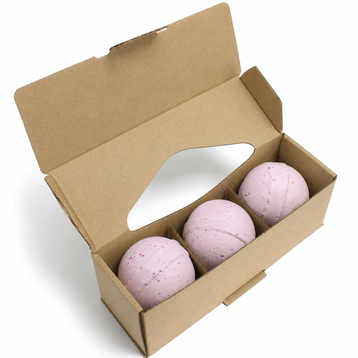 Three pink Passion Potion Bath Bombs in kraft gift box