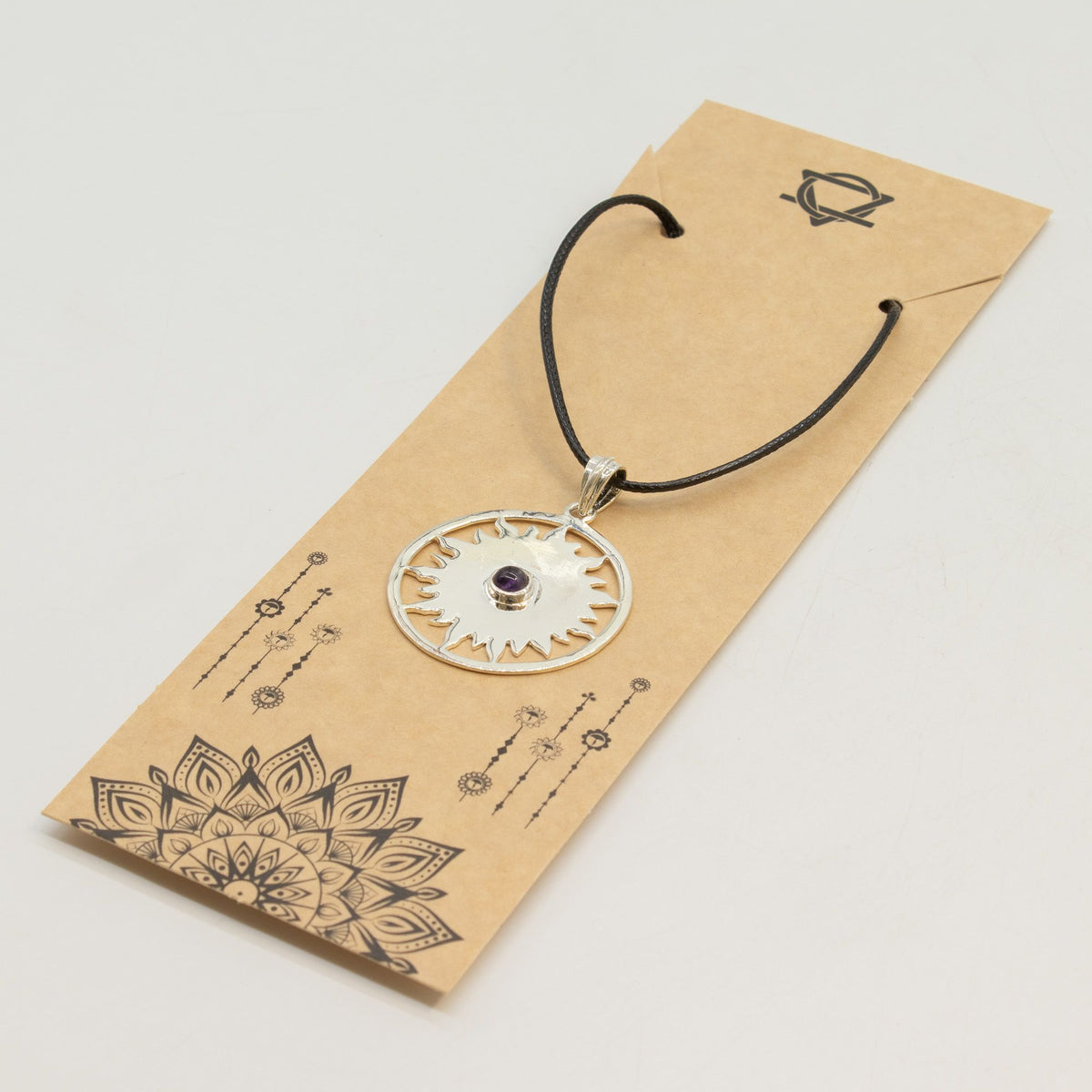 Silver-plated sun pendant necklace with purple stone