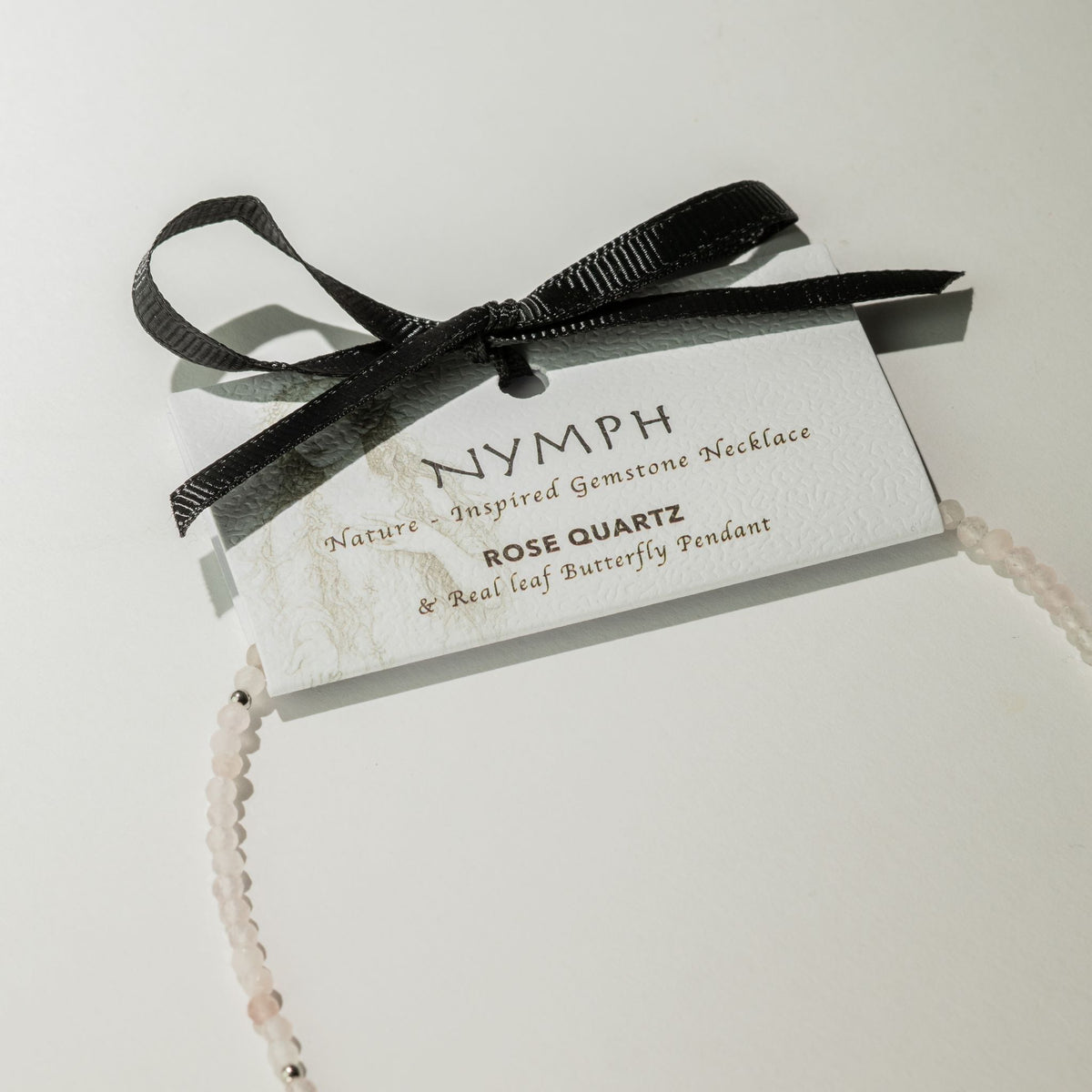 Rose Quartz butterfly necklace with Nymph gift presentation card and black ribbon
