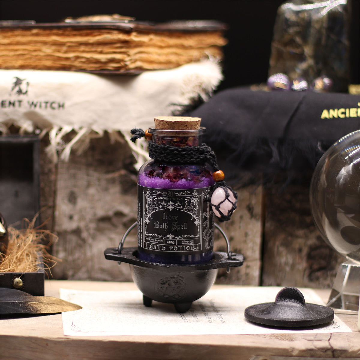 Ancient Witch Love Bath Spell Potion displayed with witchcraft accessories