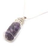 Amethyst crystal pendant necklace on a white background