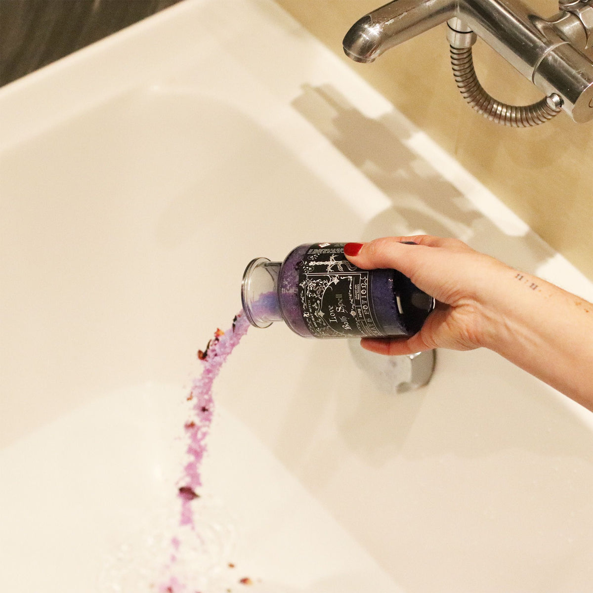 Love Bath Spell Potion being poured into bath water