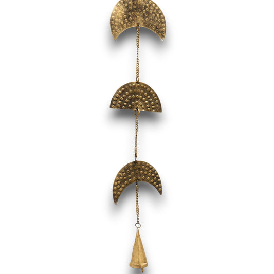 Close-up of decorative brass crescent moon wind chime