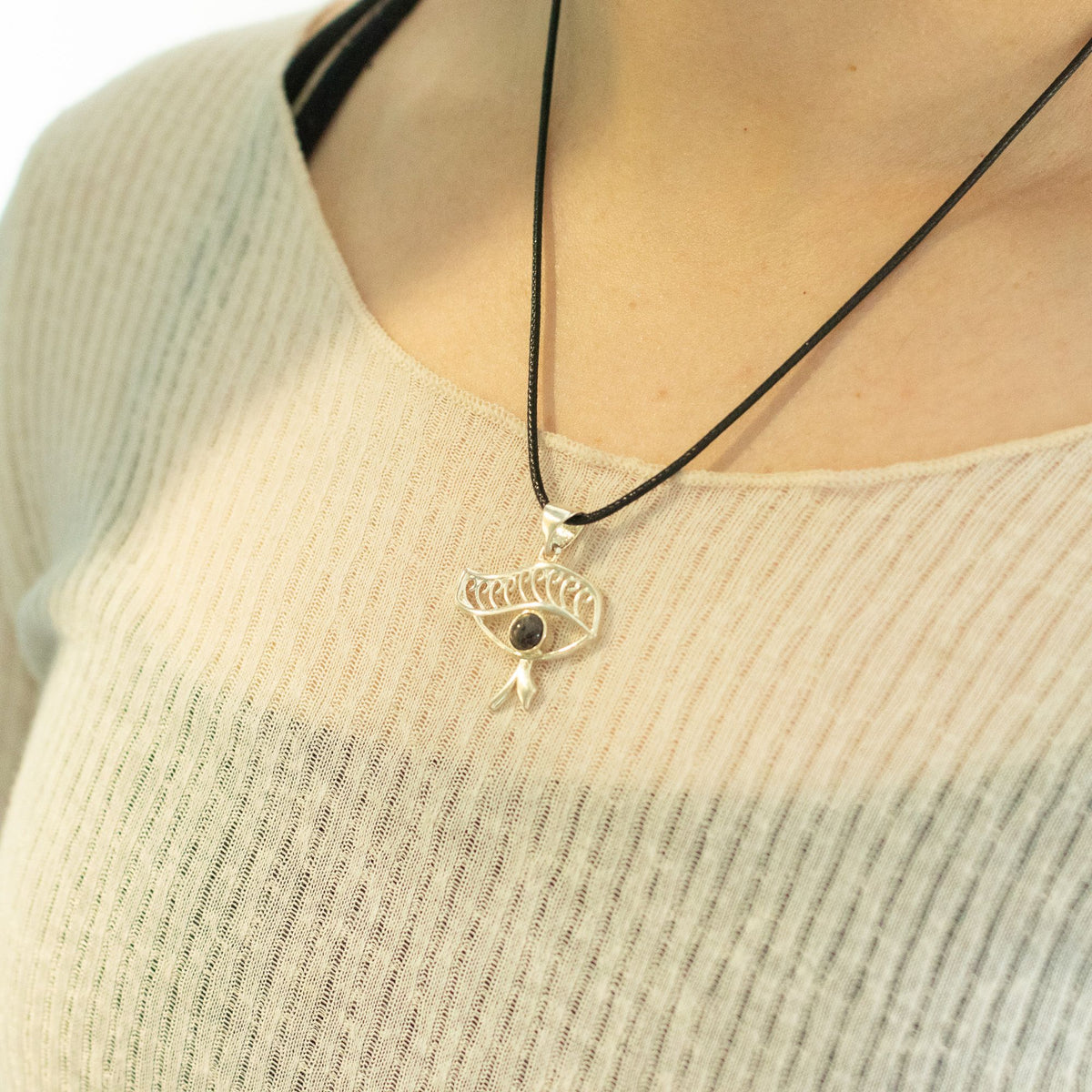 Cleopatra Eye iolite necklace worn with cream top