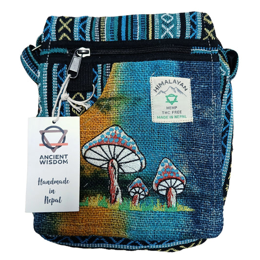 Handmade blue bag with mushroom design and Himalayan label on a white background