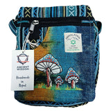 Handmade blue bag with mushroom design and Himalayan label on a white background