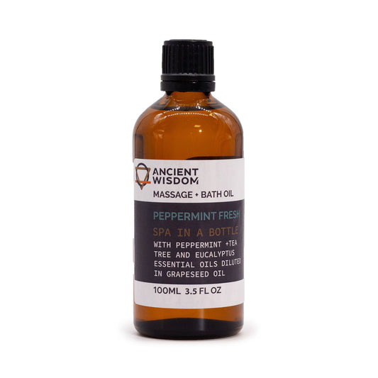 Bottle of Ancient Wisdom peppermint fresh massage bath oil on a white background