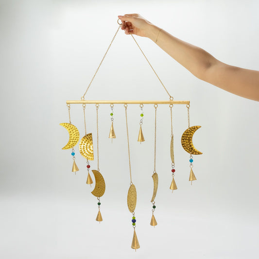 Celestial brass moon wind chime showing full hanging design