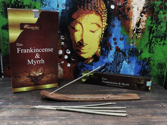 Incense sticks with Frankincense & Myrrh packaging and a Buddha image in the background.