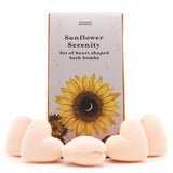 Sunflower-themed bath bombs with packaging labeled 'Sunflower Serenity' on a white background.