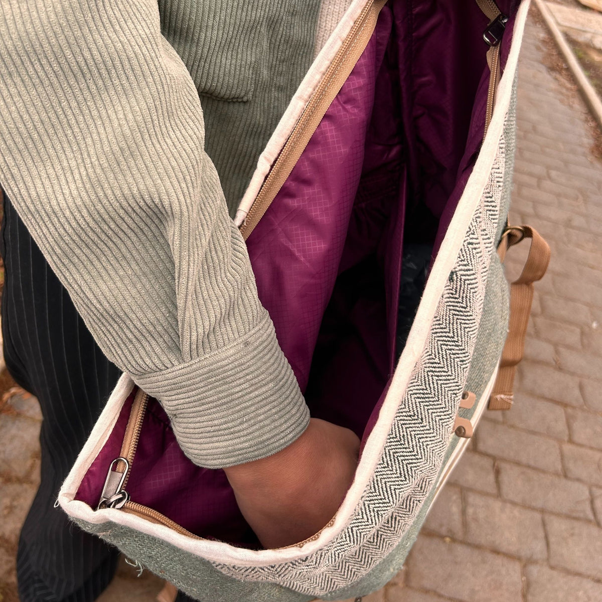 Open hemp roll top backpack showing interior compartment