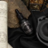 Ancient Witch Athame Noir perfume oil bottle and box in a witchy setting
