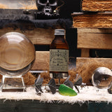 Bottle of 'Caribbean Sea Water' with a skull and books in the background