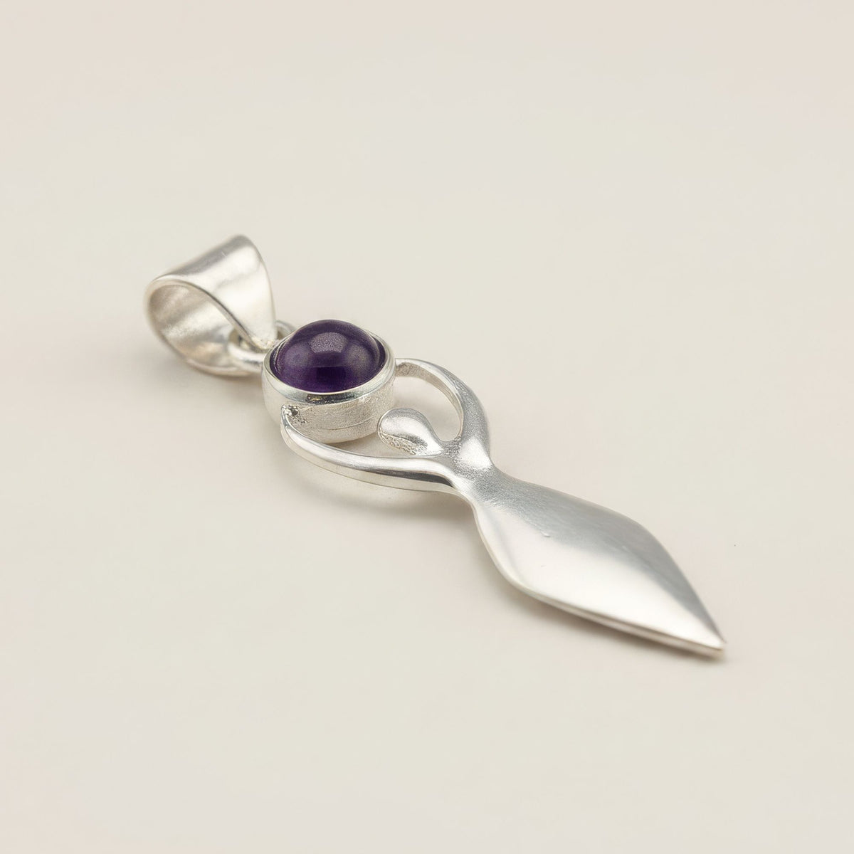 Silver goddess pendant and purple stone detail