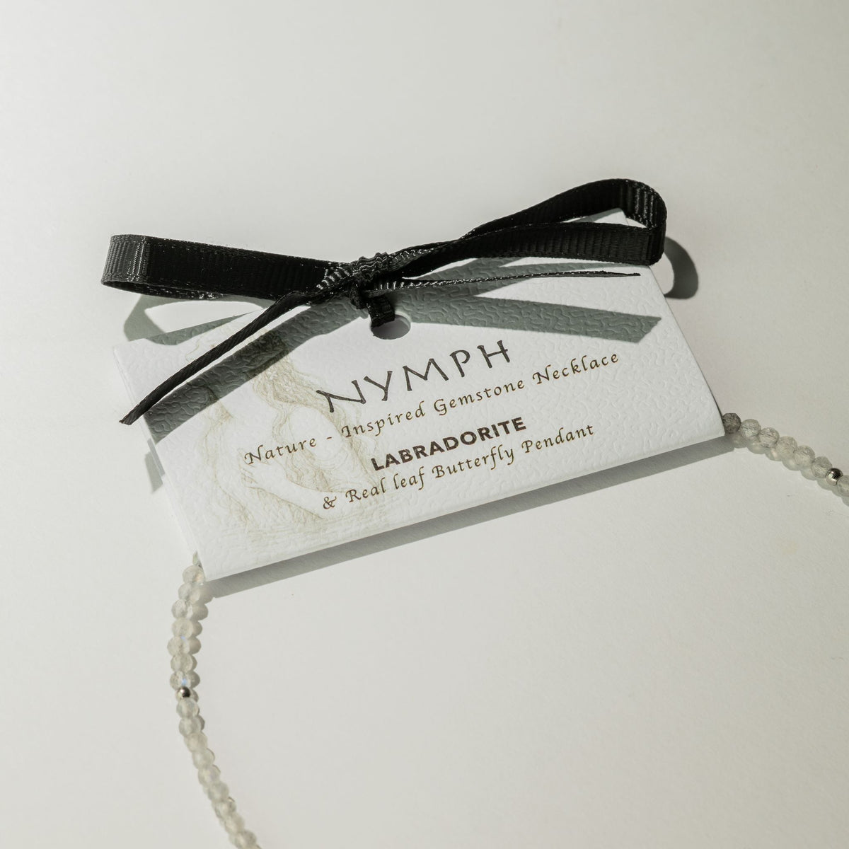 Nymph Labradorite necklace gift presentation card with black ribbon