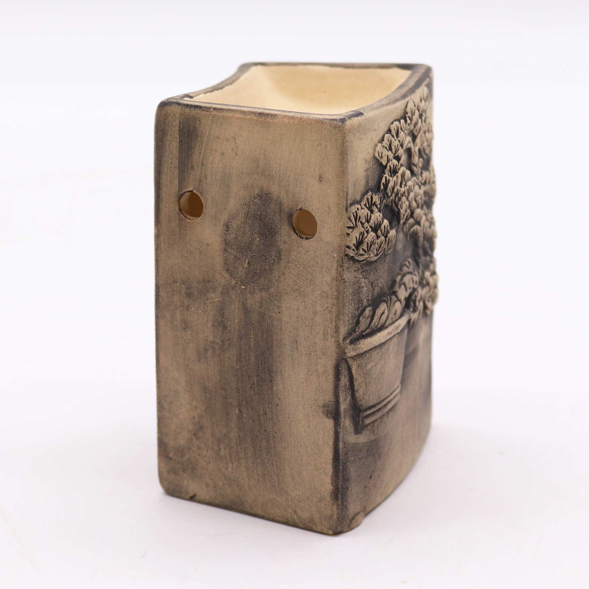 Side view of hand-painted bonsai ceramic oil burner