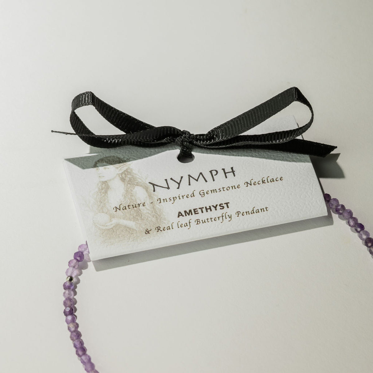 Nymph necklace gift presentation card with black ribbon