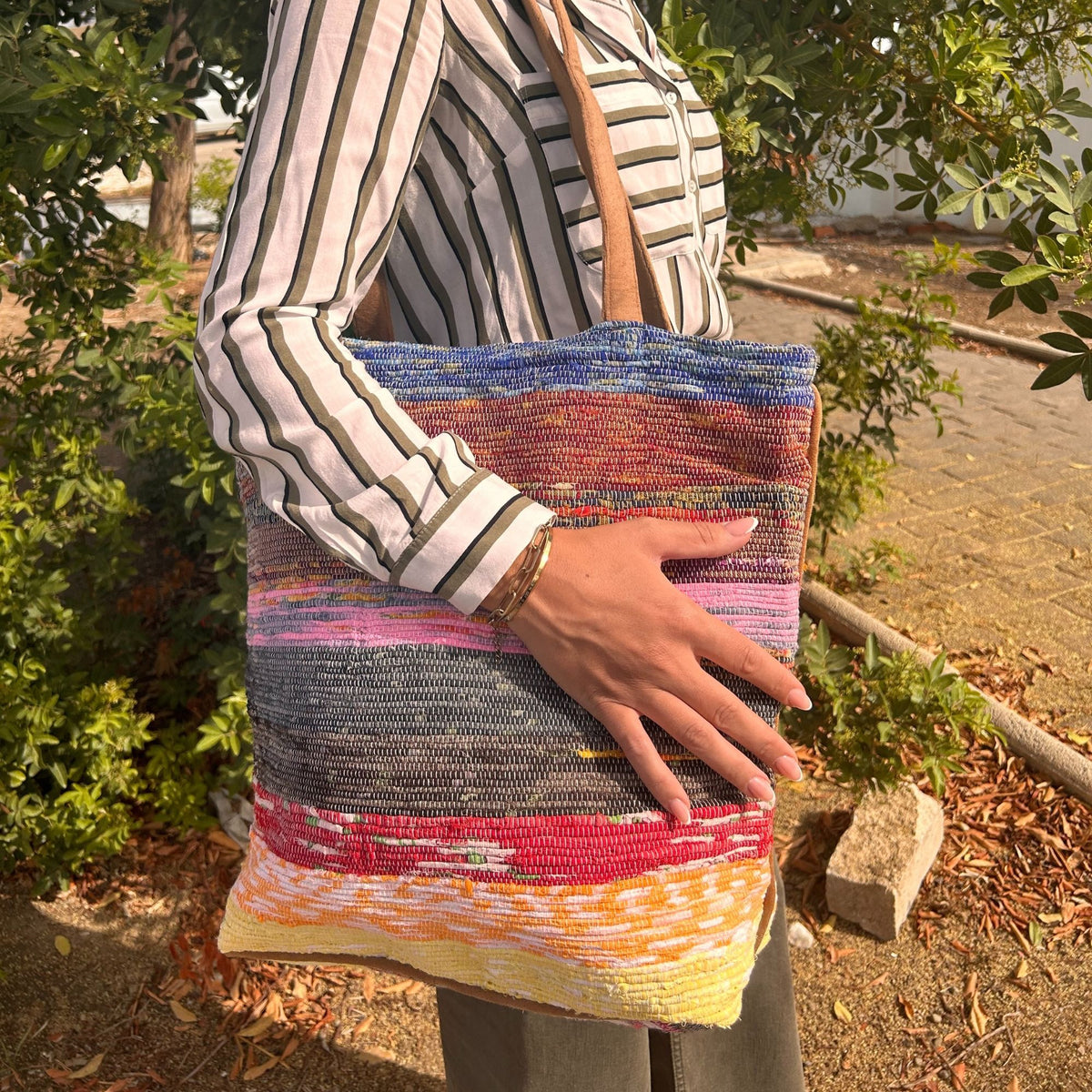 Shades of Lavender recycled woven shoulder bag being worn