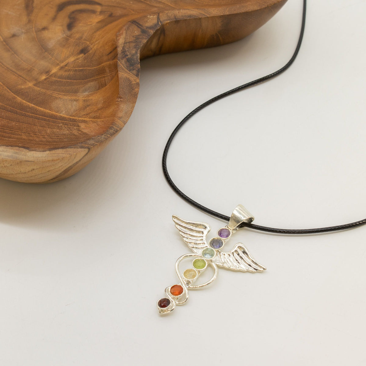 Angel chakra necklace displayed with black cord