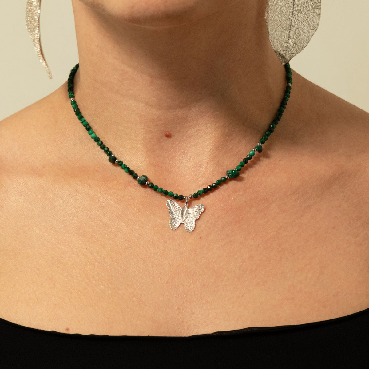 Nymph Malachite gemstone necklace worn around the neck