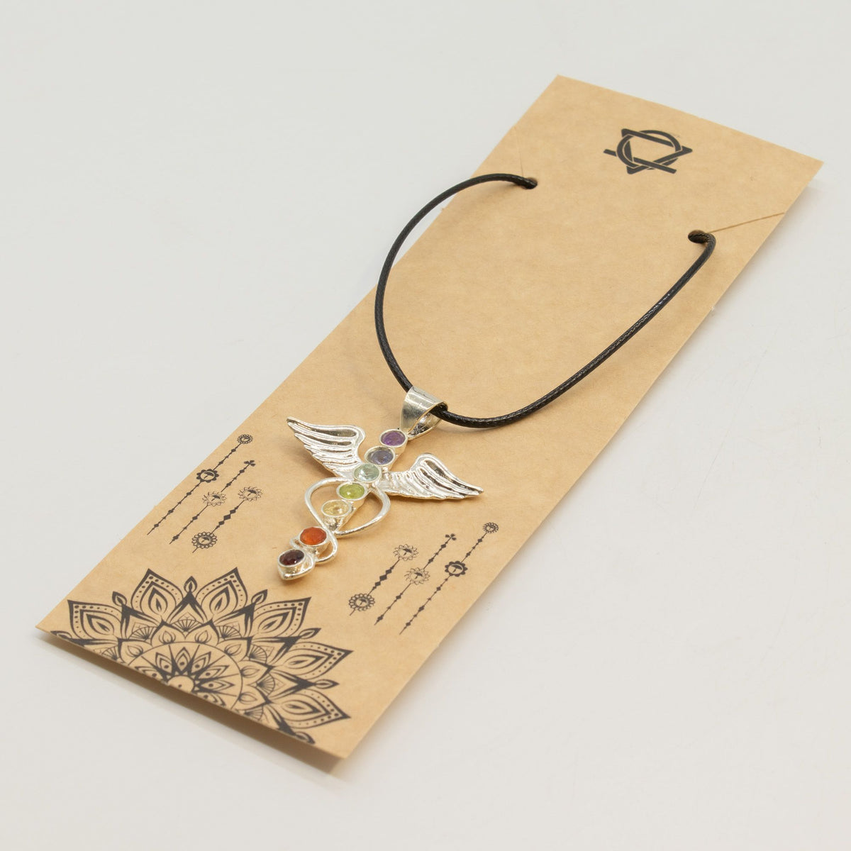 Angel chakra pendant necklace on jewellery display card