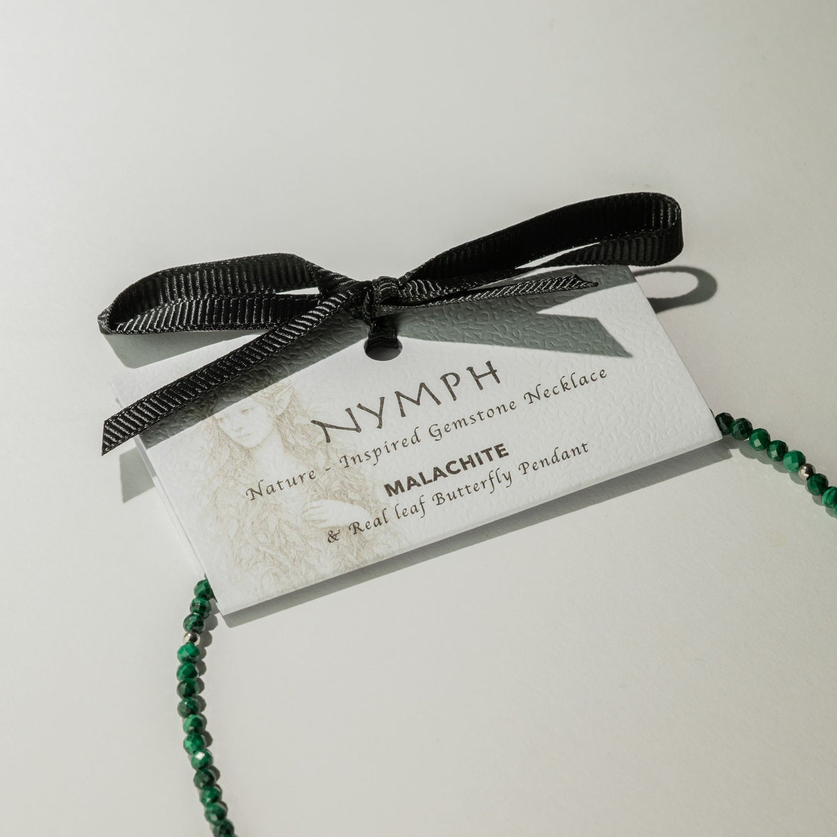 Nymph Malachite necklace gift presentation card with black ribbon
