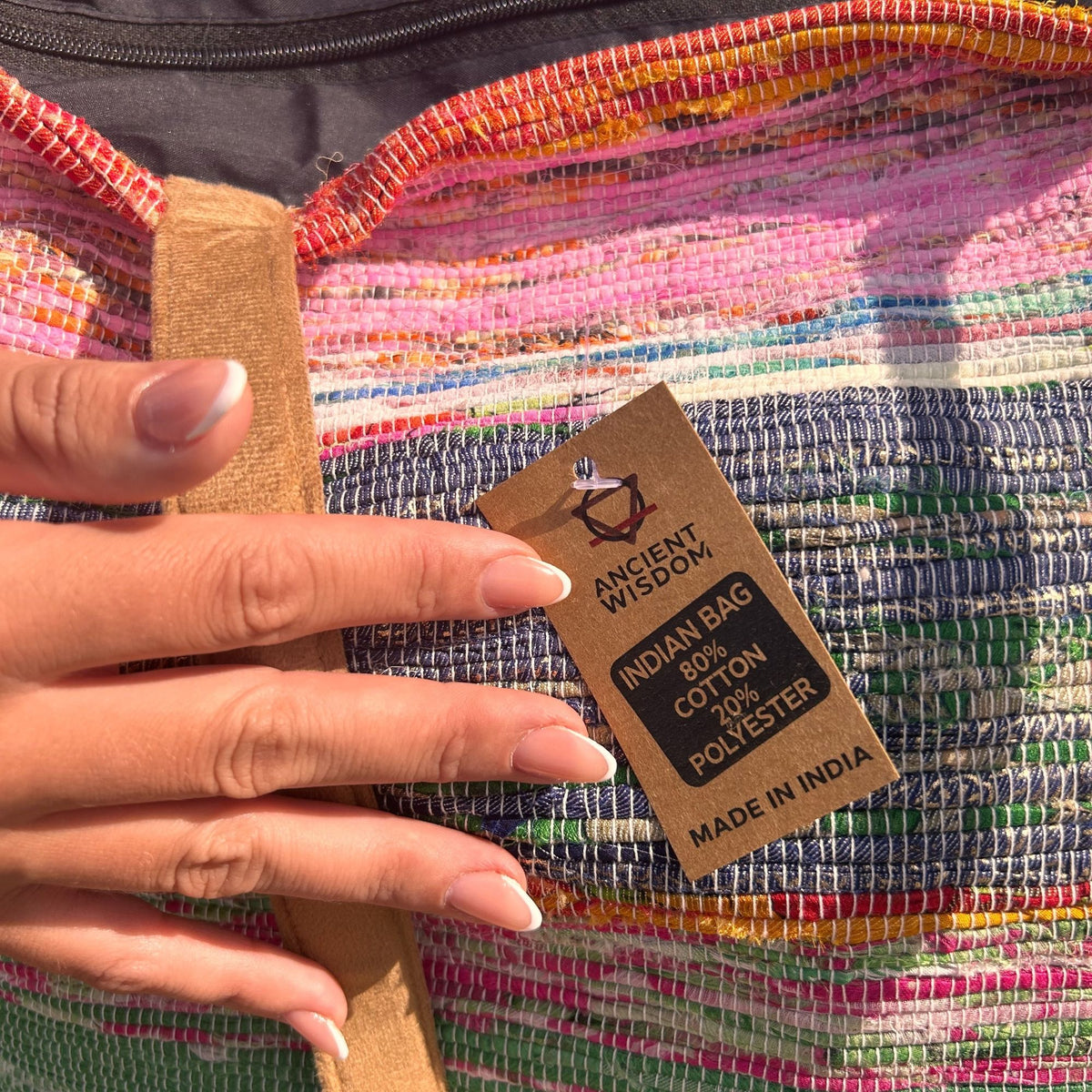 Close-up of colourful recycled woven fabric and label