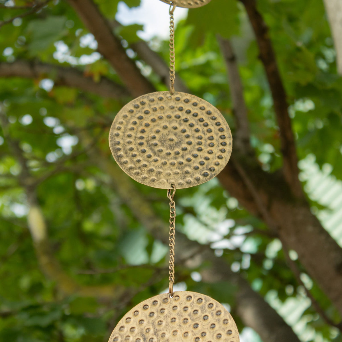 1. Close-up of circular brass moon phase design