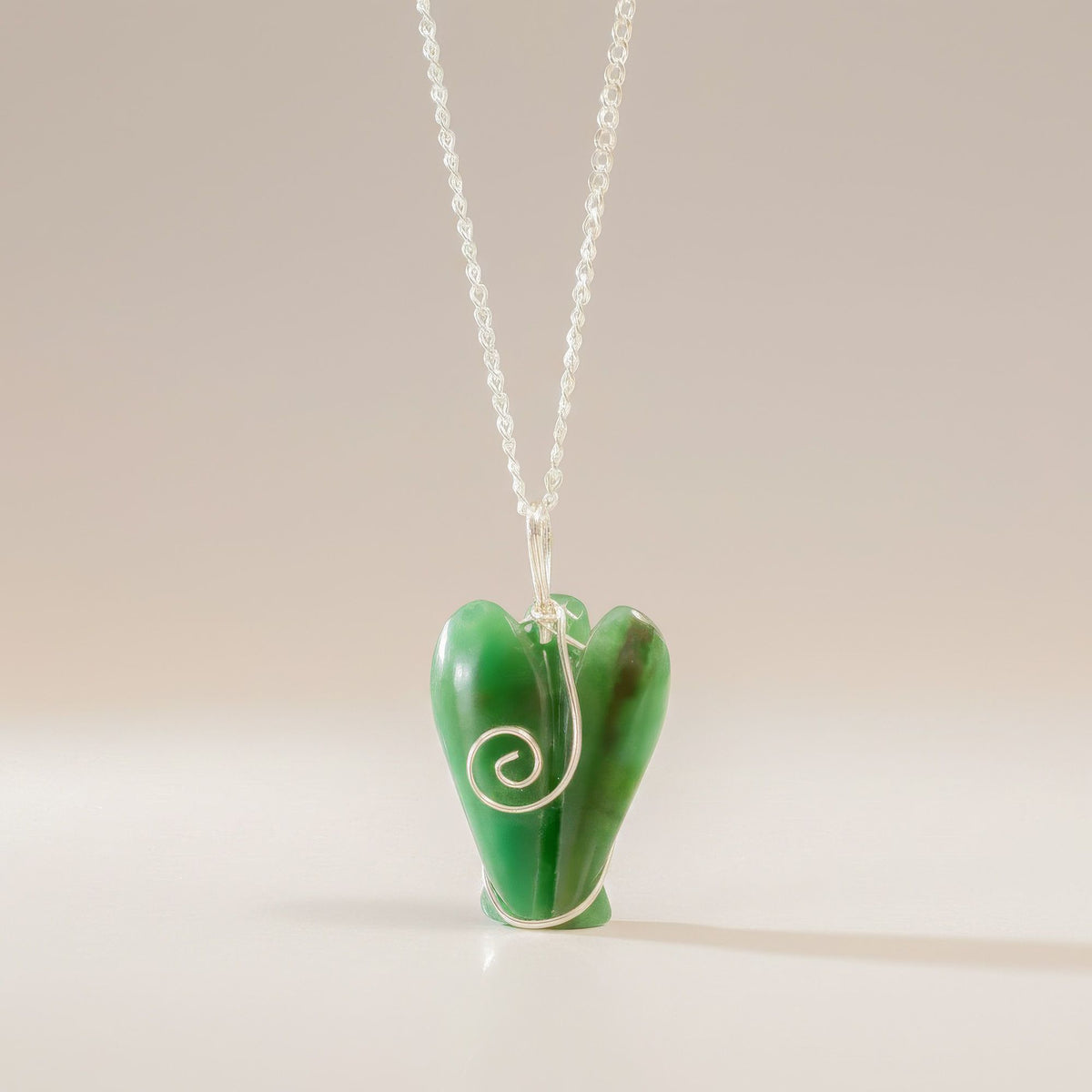Rear view of carved Green Aventurine angel crystal pendant