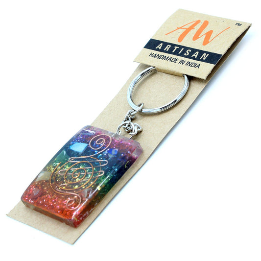Keychain with colorful design on a 'AW Artisan' branded card