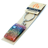 Keychain with colorful design on a 'AW Artisan' branded card