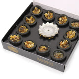 Box of Frankincense resin cups with a silver incense holder on a white background