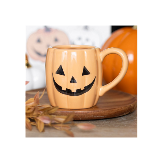 Jack-o'-lantern pumpkin shaped mug with smiling Halloween face