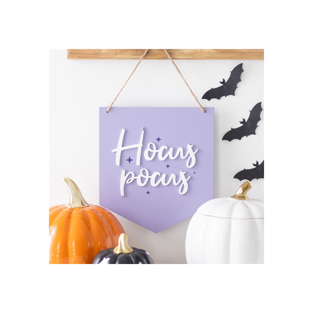Purple Hocus Pocus sign styled with Halloween decorations