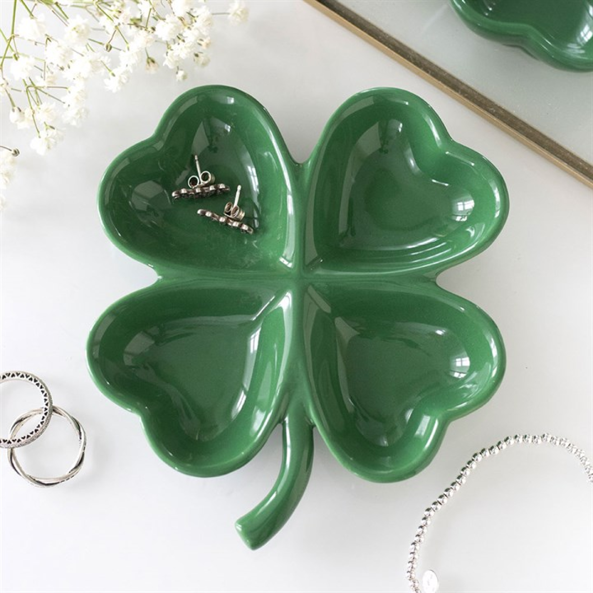 Green four-leaf clover ceramic trinket dish with jewellery