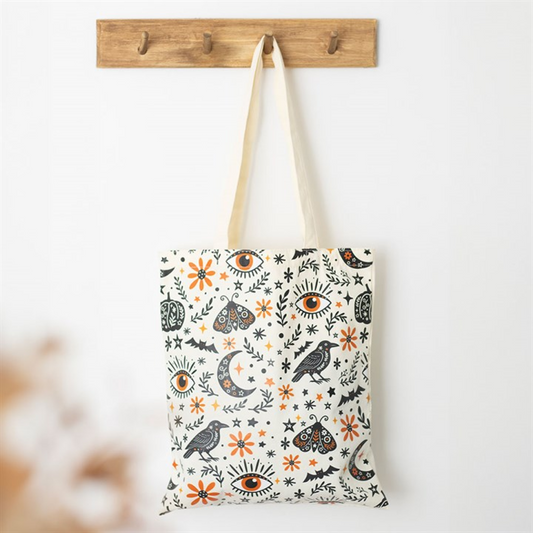 Frightful Folk autumn print tote bag with moths ravens moons and florals