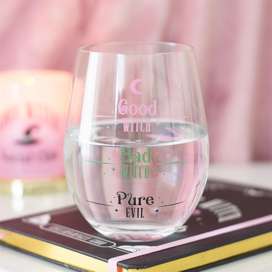 Good Witch Bad Witch stemless glass displayed on stacked books