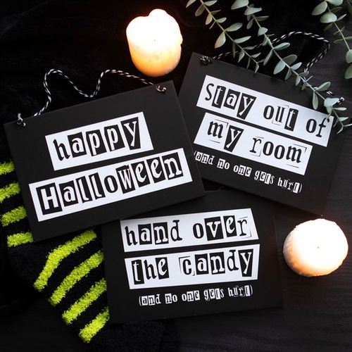 Black and white Halloween hanging signs display