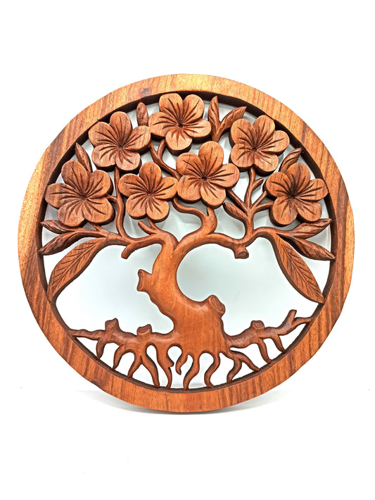 Close-up of carved frangipani flowers on Tree of Life wood wall art
