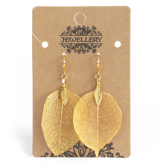 Gold-coloured real leaf drop earrings on display card
