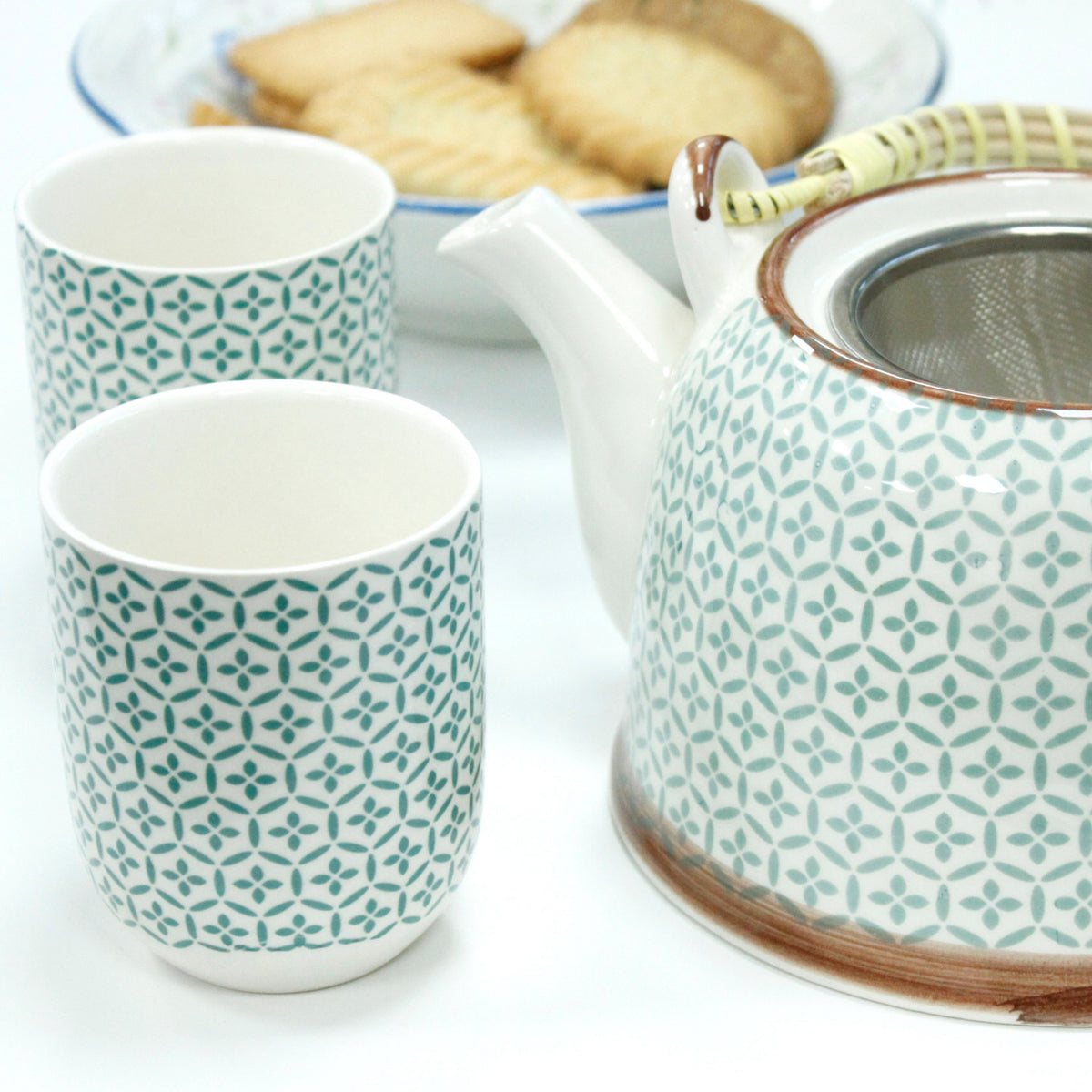 Green mosaic ceramic teapot and matching tea cups