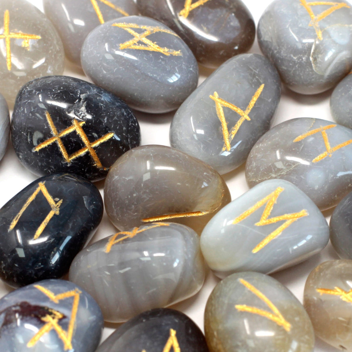 Carved Grey Agate crystal rune stones close up
