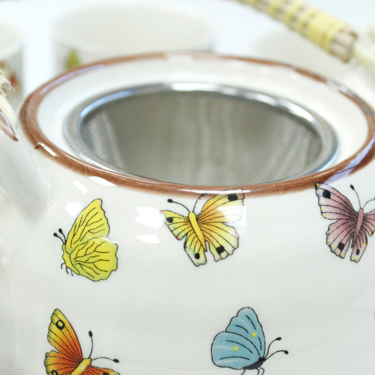 herbal teapot with attached metal strainer